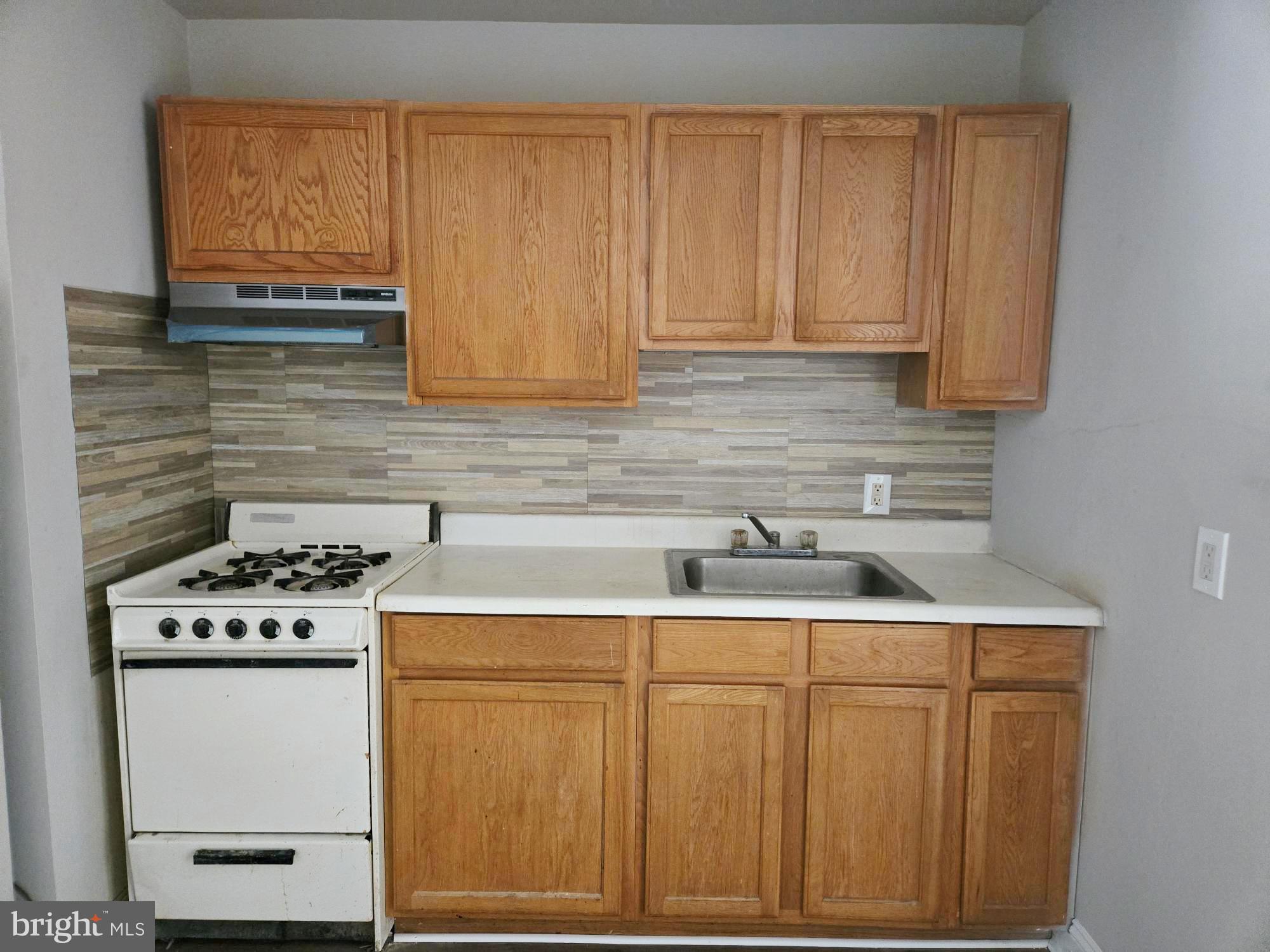 61 Owen Avenue Lansdowne, PA 19050 - Photo 8 of 19 a kitchen with granite countertop cabinets stainless steel appliances and sink