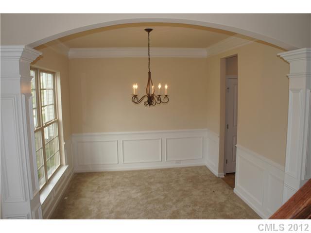413 Rook Road Charlotte, NC 28216 - Photo 3 of 12 a view of a room with a chandelier fan and windows