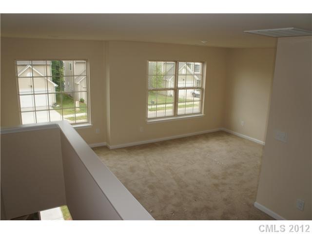 413 Rook Road Charlotte, NC 28216 - Photo 8 of 12 a view of an empty room with a window