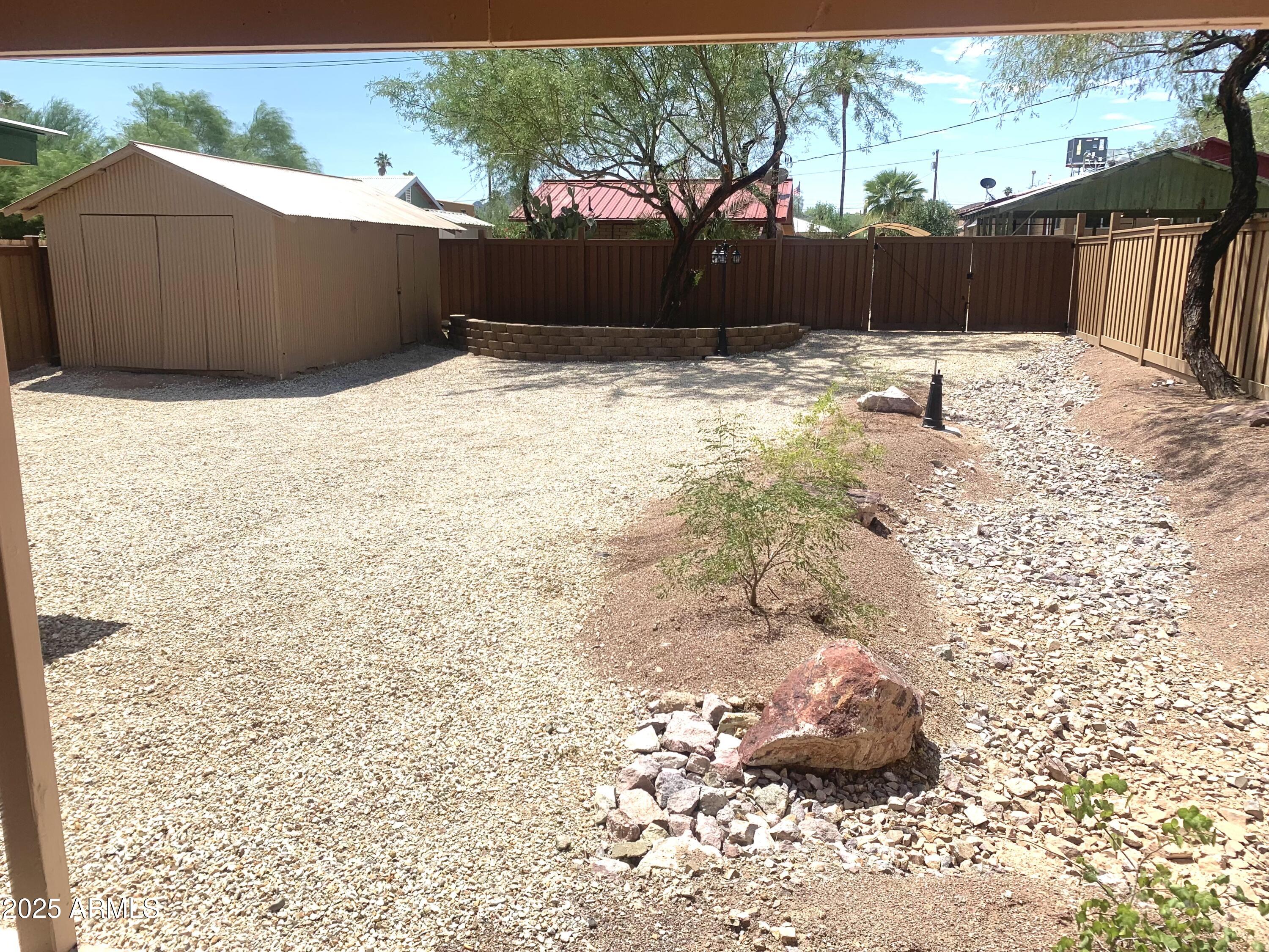 311 Solana Avenue Ajo, AZ 85321 - Photo 14 of 22 a backyard of a house