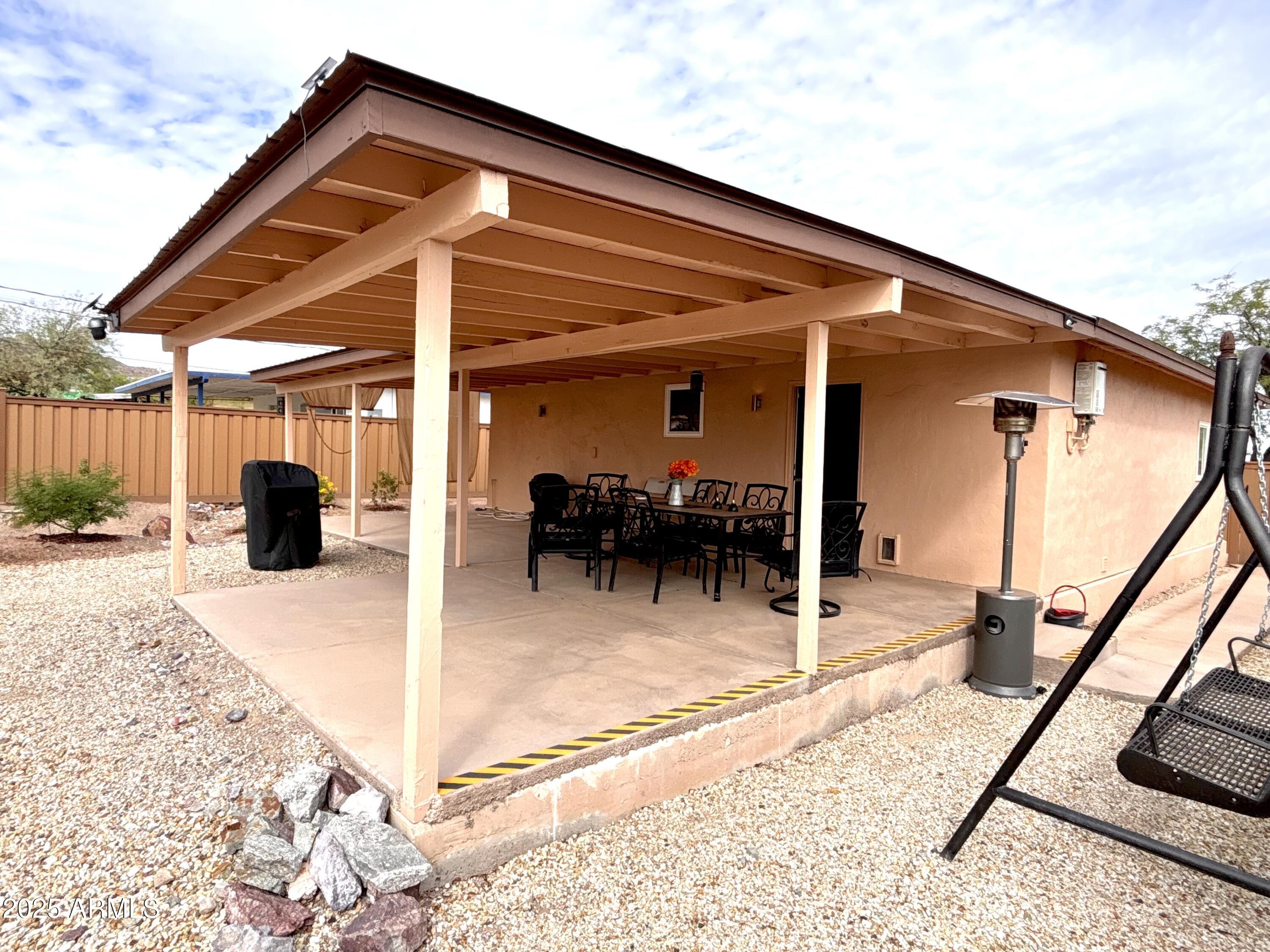 311 Solana Avenue Ajo, AZ 85321 - Photo 18 of 22 a patio with table and chairs