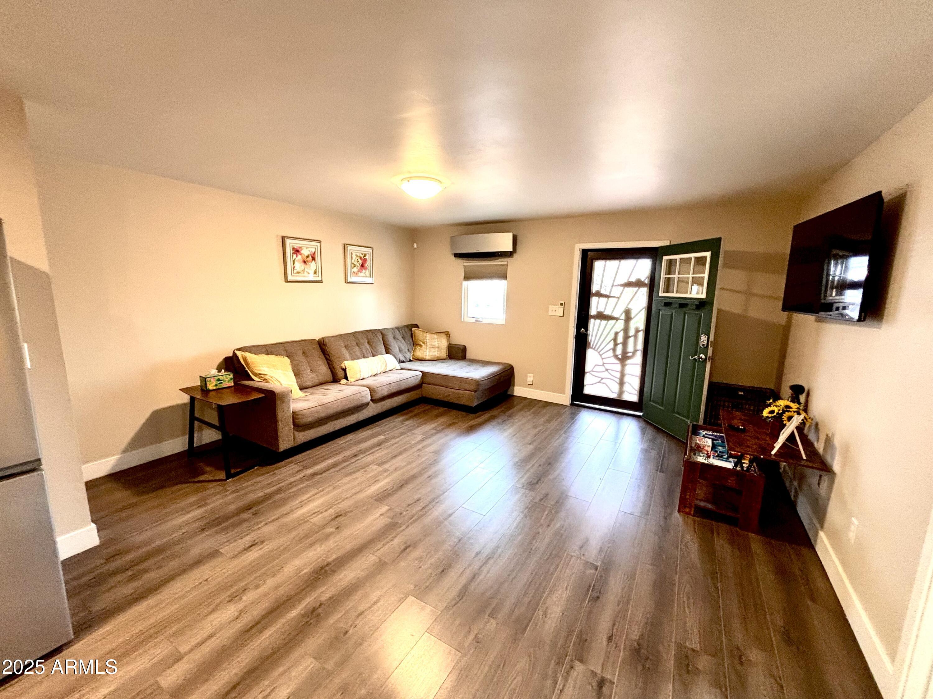 311 Solana Avenue Ajo, AZ 85321 - Photo 2 of 22 a living room with furniture and a flat screen tv