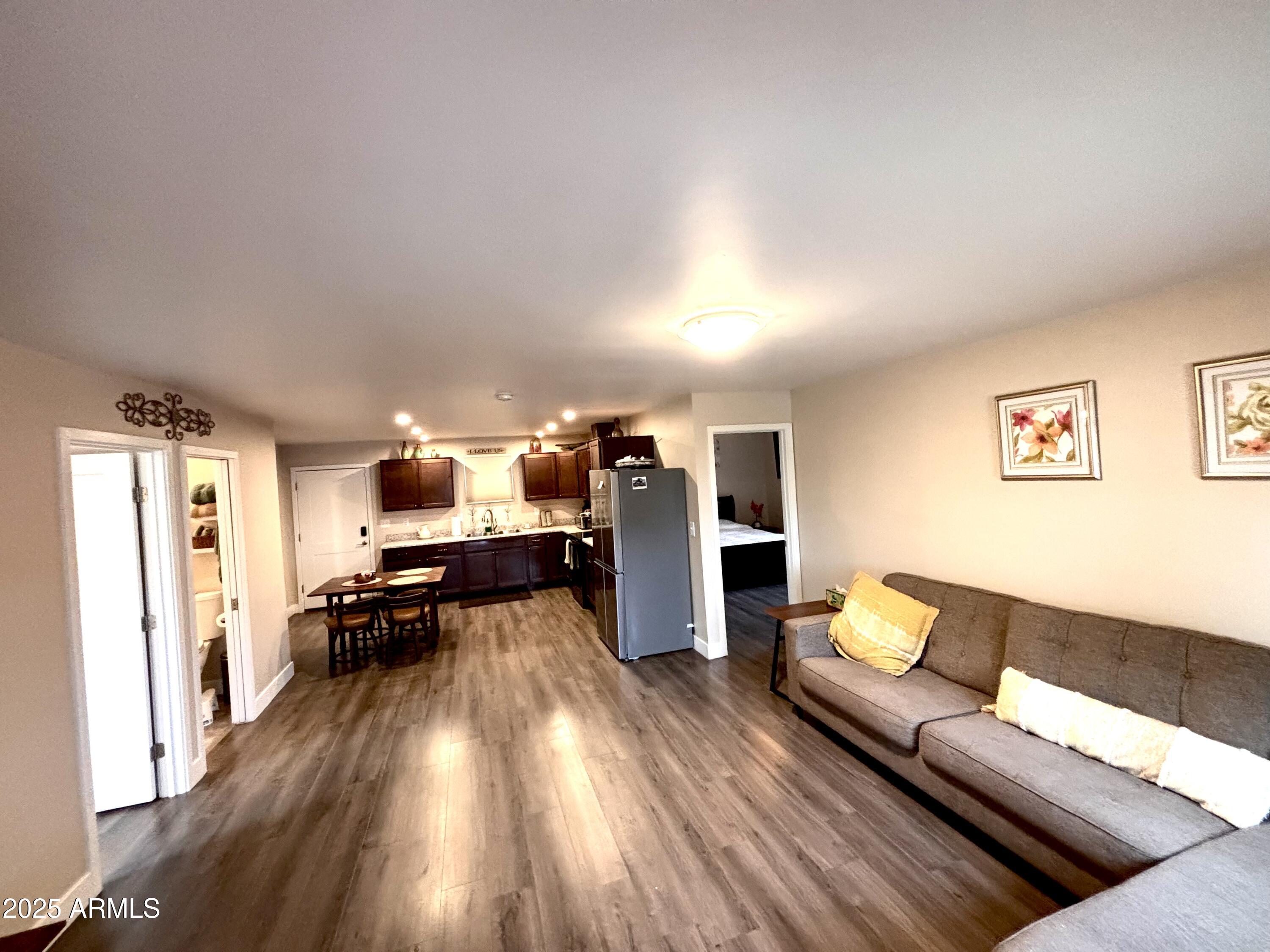 311 Solana Avenue Ajo, AZ 85321 - Photo 4 of 22 a living room with furniture and wooden floor