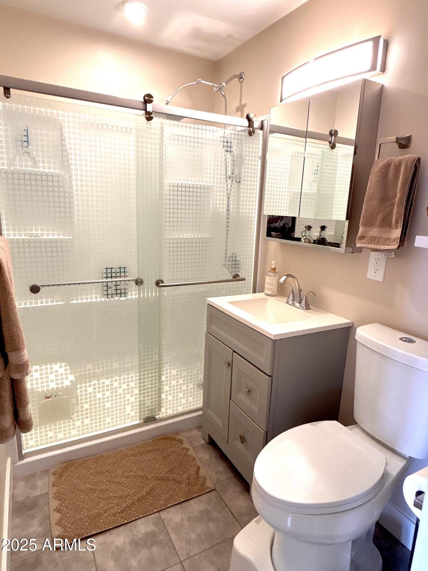 311 Solana Avenue Ajo, AZ 85321 - Photo 7 of 22 a bathroom with a sink toilet and shower