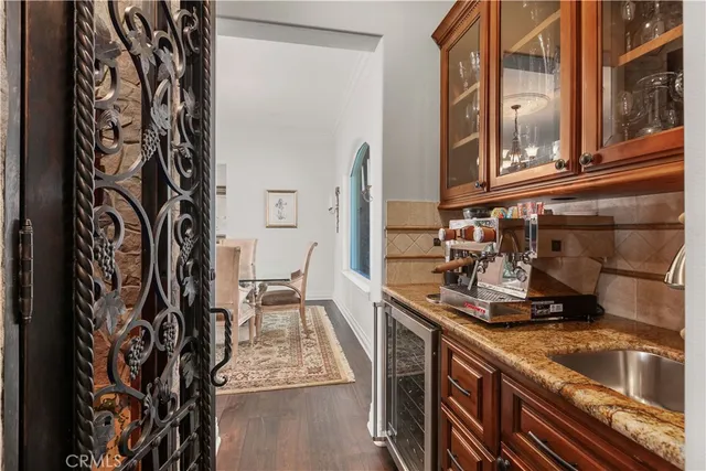 a kitchen with a sink and a refrigerator
