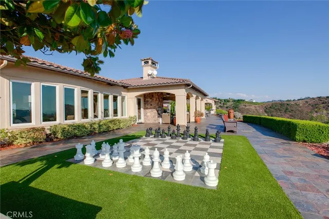 a front view of a house with garden and porch