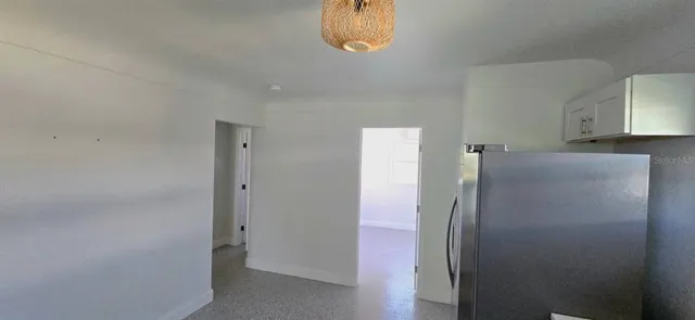 a room with window and cabinet