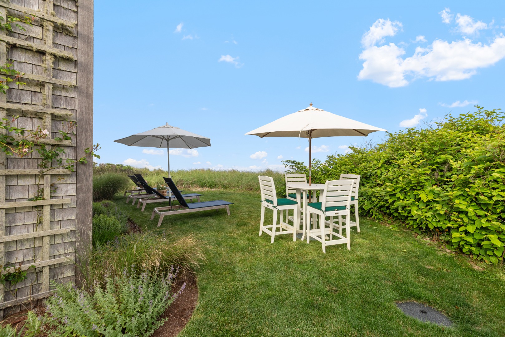 3 North Gully Road Nantucket, MA 02554 - Photo 30 of 43 a lawn chair sitting under a blue umbrella