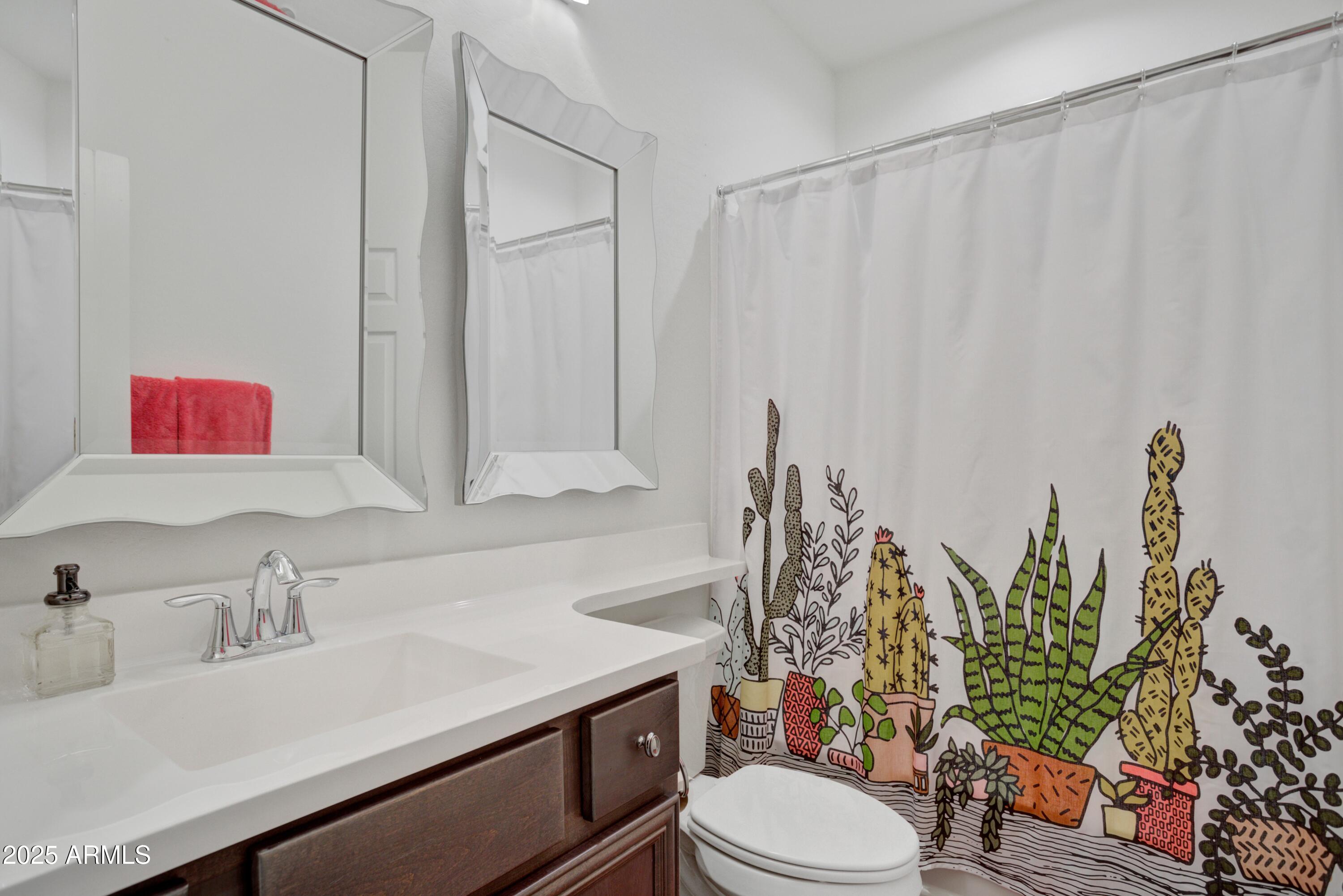 17919 East Slide Rock Drive Rio Verde, AZ 85263 - Photo 20 of 48 a bathroom with a sink vanity mirror and toilet