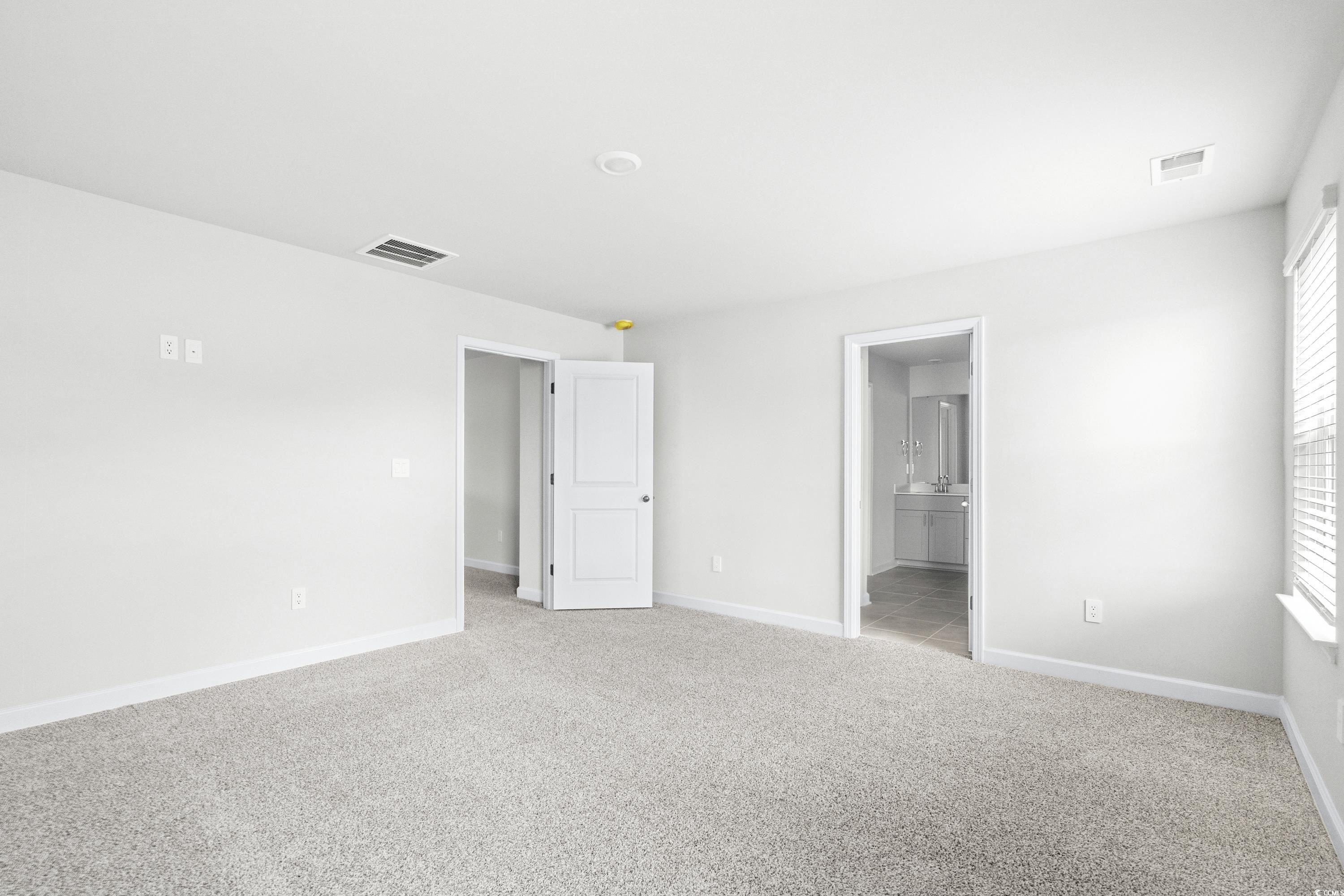 2113 Copper Crk Loop Longs, SC 29568 - Photo 18 of 37 Unfurnished bedroom featuring light colored carpet
