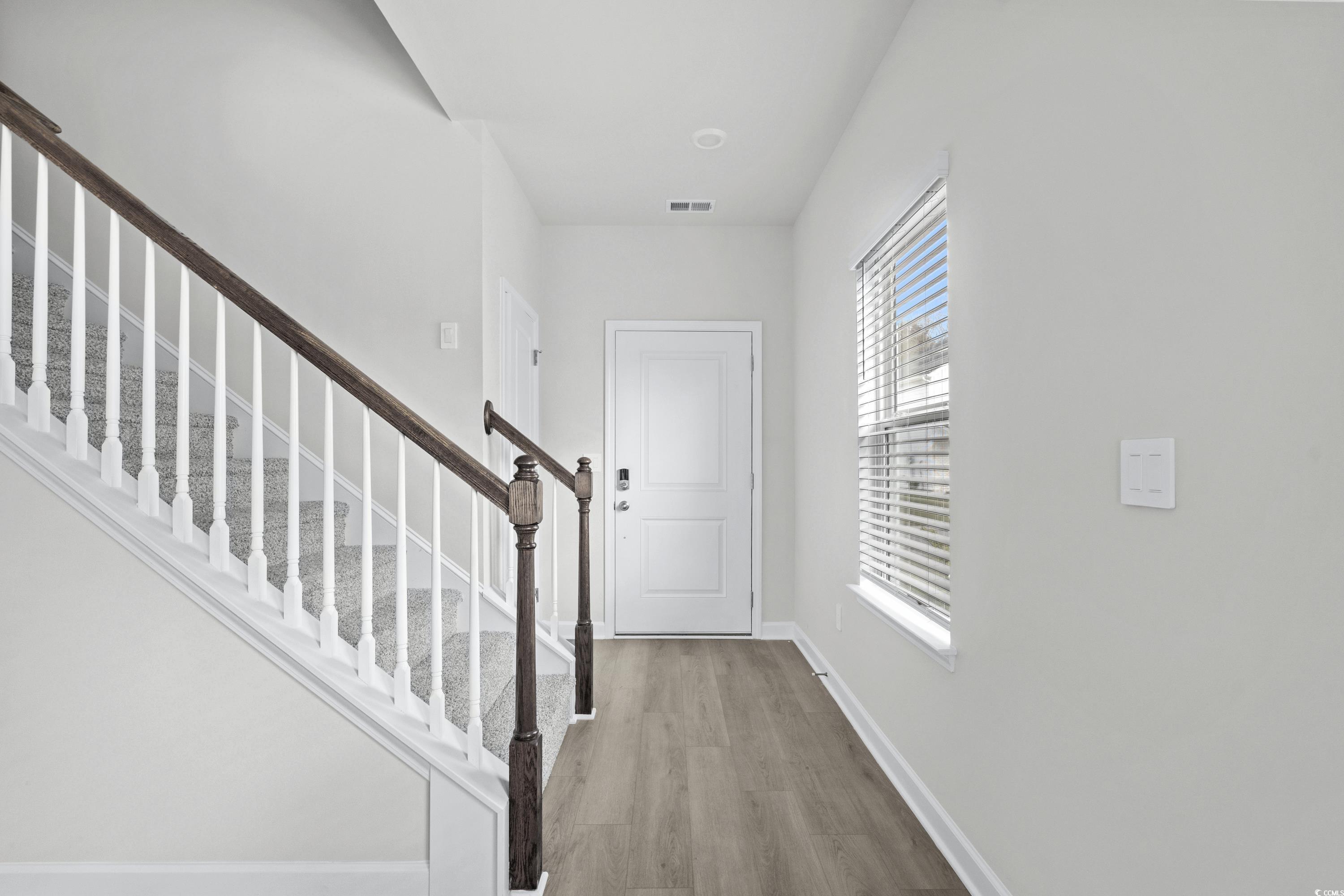 2113 Copper Crk Loop Longs, SC 29568 - Photo 3 of 37 Entrance foyer with light hardwood / wood-style fl