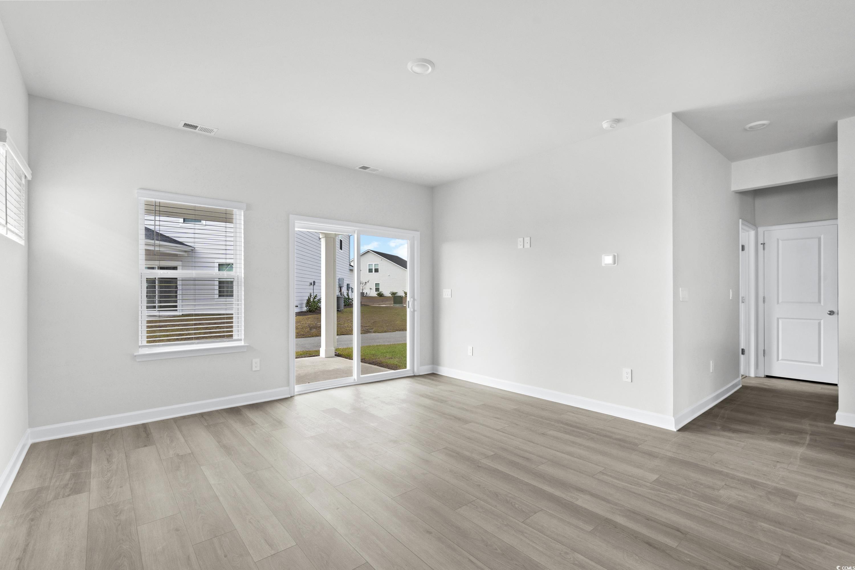 2113 Copper Crk Loop Longs, SC 29568 - Photo 5 of 37 Empty room featuring light hardwood / wood-style f