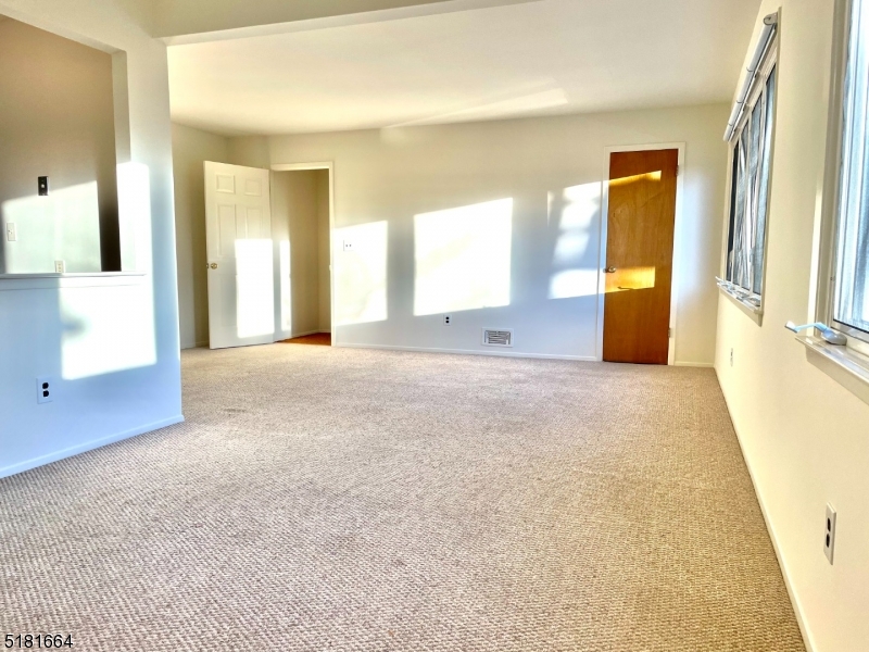 365 Patricia Court Union, NJ 07083 - Photo 3 of 14 a view of a big room with windows and chandelier