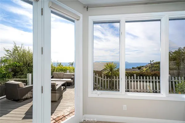 a view of a balcony with furniture