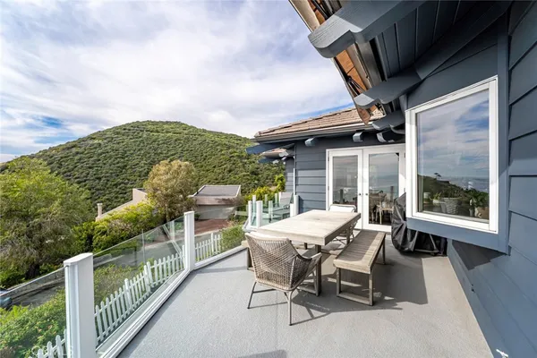 a view of a balcony with wooden floor