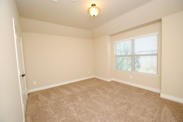 an empty room with a empty space and a window