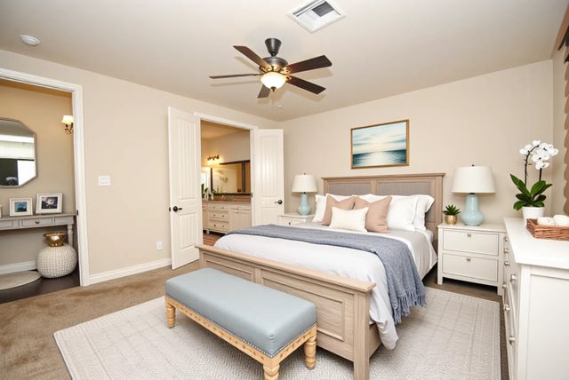 a spacious bedroom with a bed and window