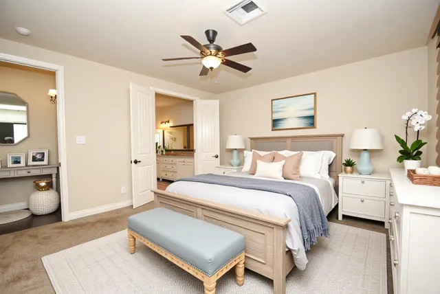 a spacious bedroom with a bed and window