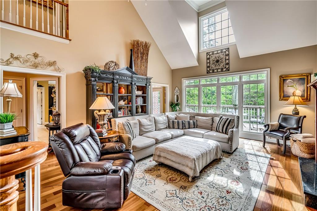 411 Overlook Way Cohutta, GA 30710 - Photo 17 of 86 a living room with furniture chandelier and a large window