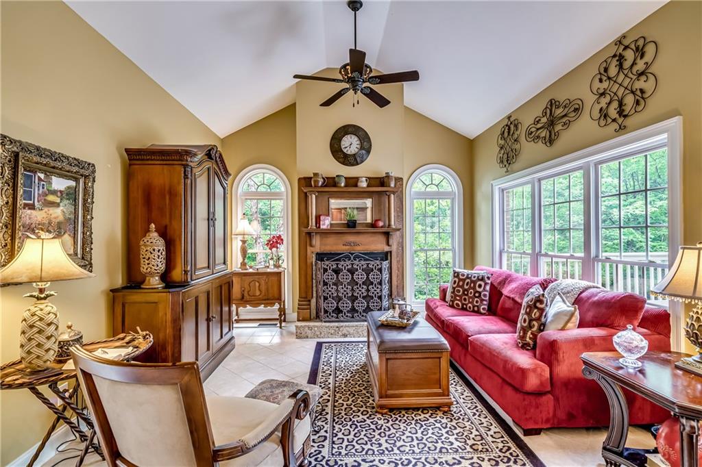 411 Overlook Way Cohutta, GA 30710 - Photo 40 of 86 a living room with furniture a clock and a large window