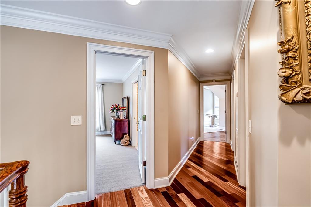 411 Overlook Way Cohutta, GA 30710 - Photo 58 of 86 a view of a hallway with wooden floor and staircase