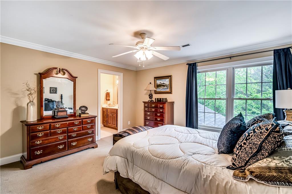 411 Overlook Way Cohutta, GA 30710 - Photo 59 of 86 a bedroom with a bed and a dresser next to a window