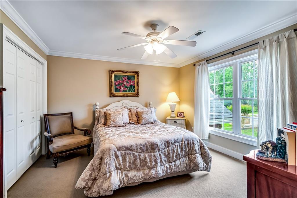 411 Overlook Way Cohutta, GA 30710 - Photo 62 of 86 a bedroom with a bed and a couch