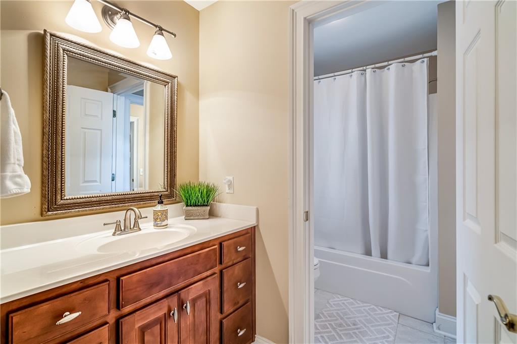 411 Overlook Way Cohutta, GA 30710 - Photo 67 of 86 a bathroom with a double vanity sink and a mirror