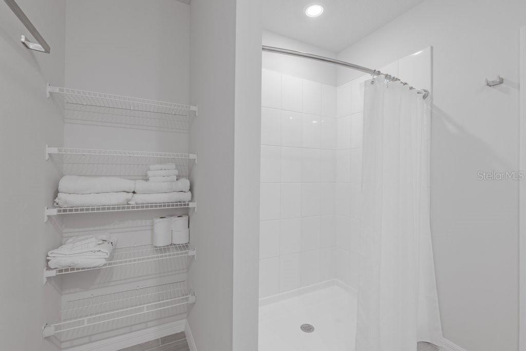 7041 Feather River Place Parrish, FL 34219 - Photo 17 of 32 a bathroom with a shower a toilet and sink