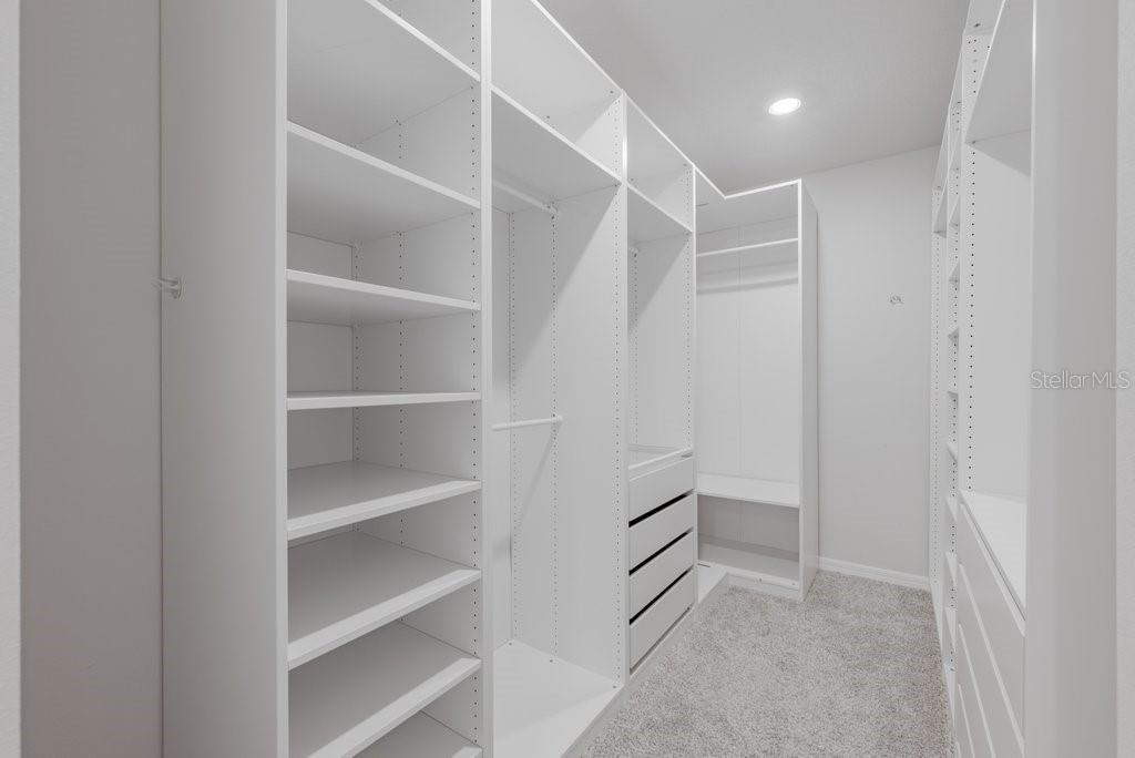 7041 Feather River Place Parrish, FL 34219 - Photo 18 of 32 a view of an empty walk in closet