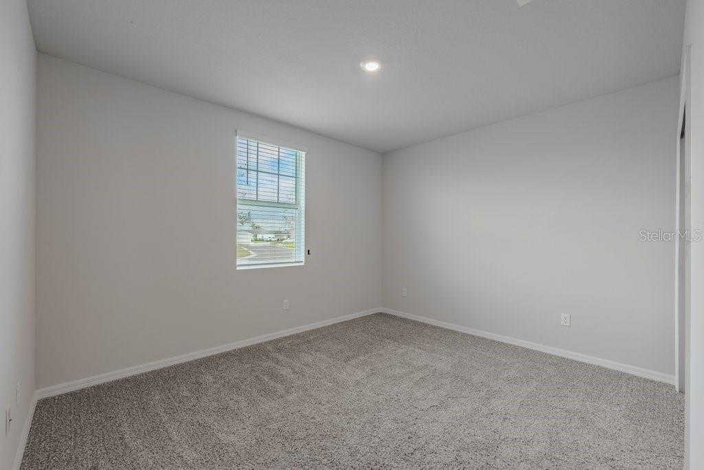 7041 Feather River Place Parrish, FL 34219 - Photo 19 of 32 an empty room with a window