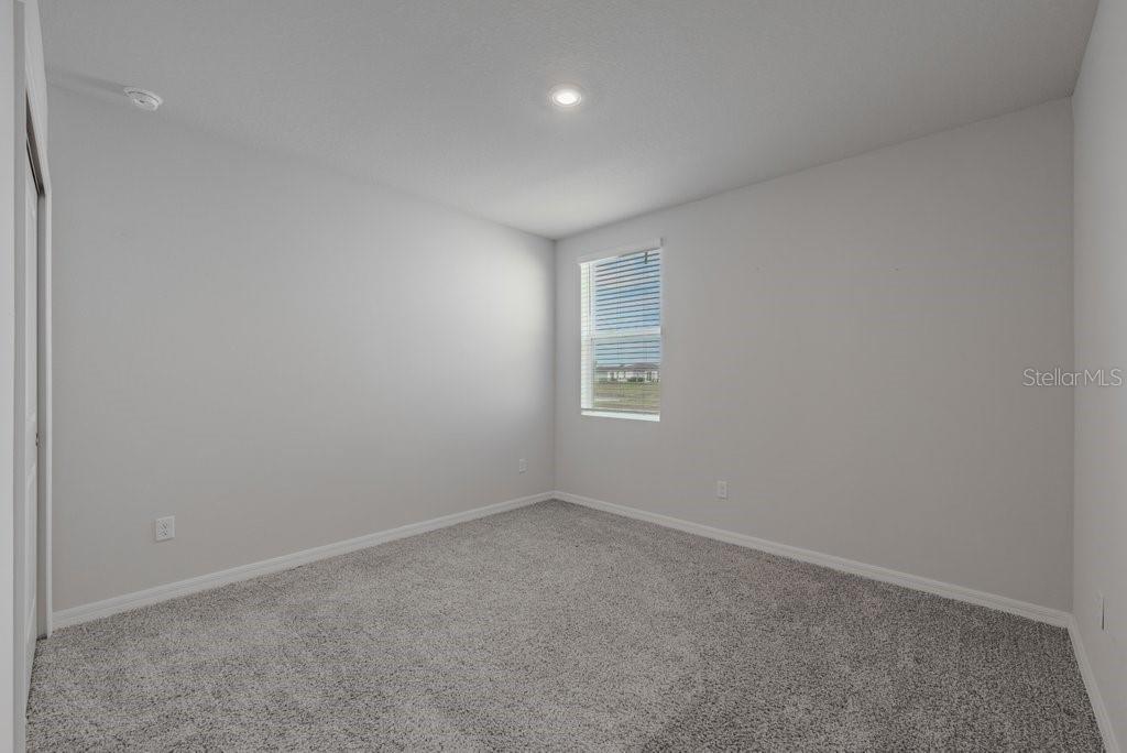 7041 Feather River Place Parrish, FL 34219 - Photo 22 of 32 an empty room with windows and closet