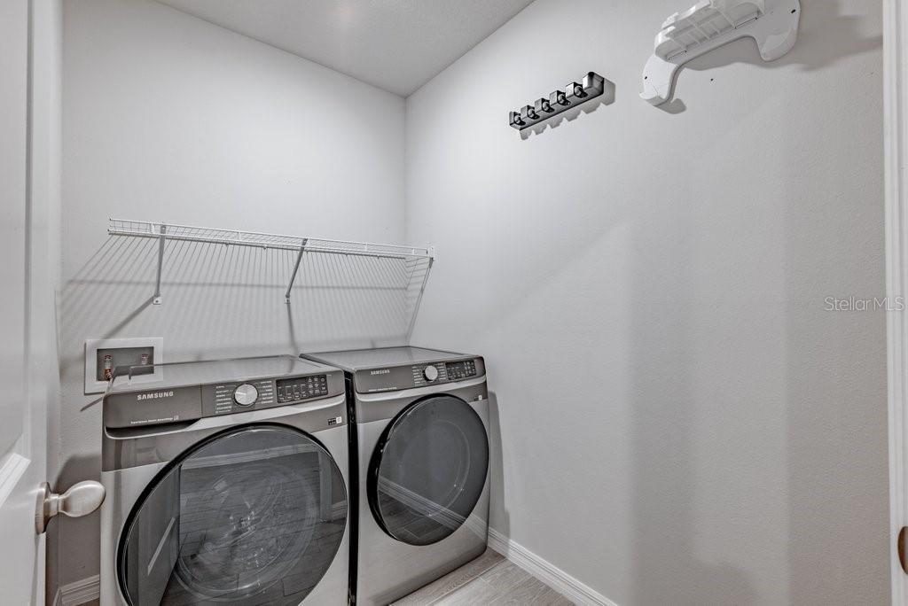 7041 Feather River Place Parrish, FL 34219 - Photo 24 of 32 a utility room with dryer and washer