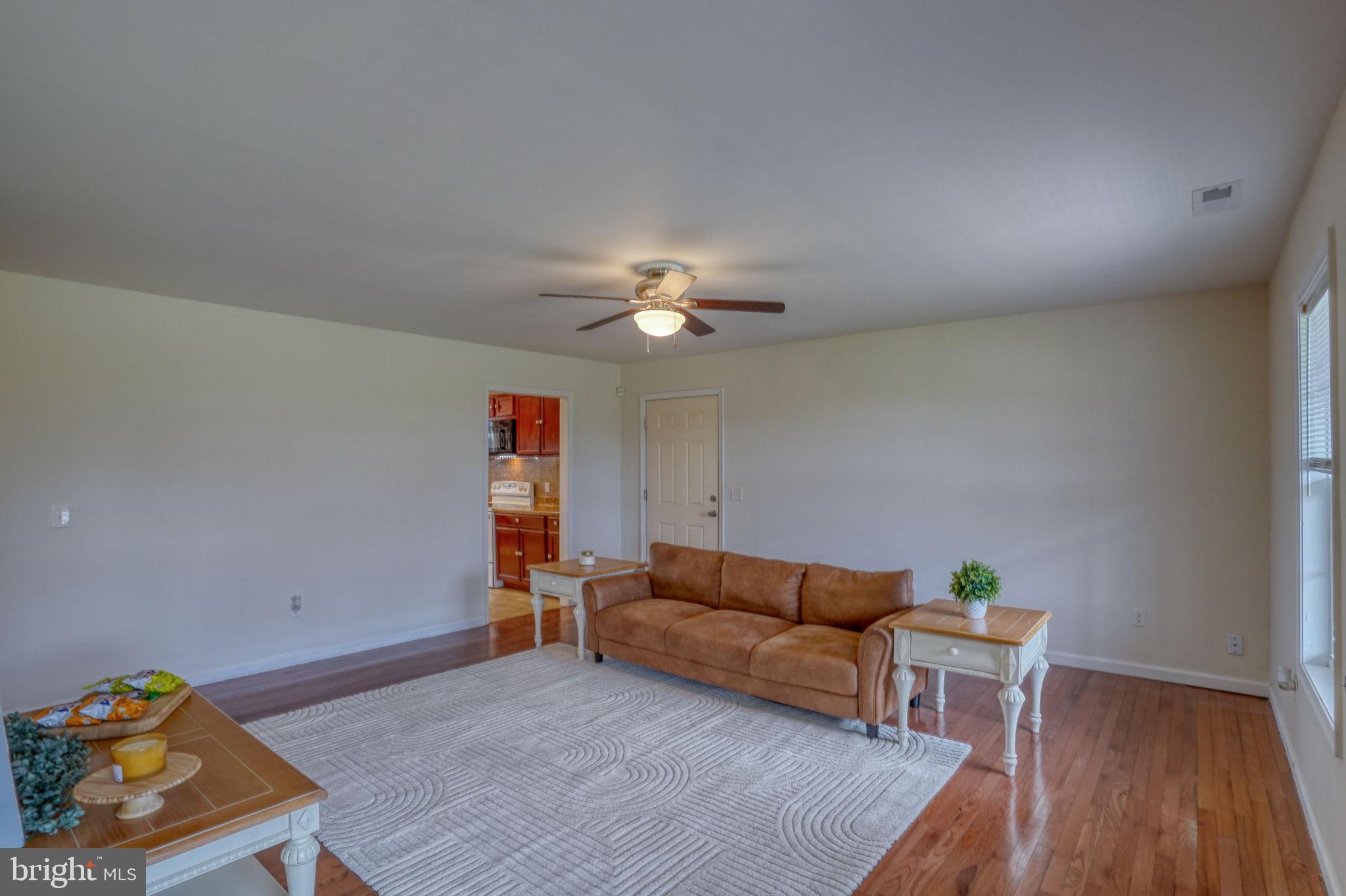 5926 Mt Holly Road East New Market, MD 21631 - Photo 14 of 36 a living room with furniture and wooden floor