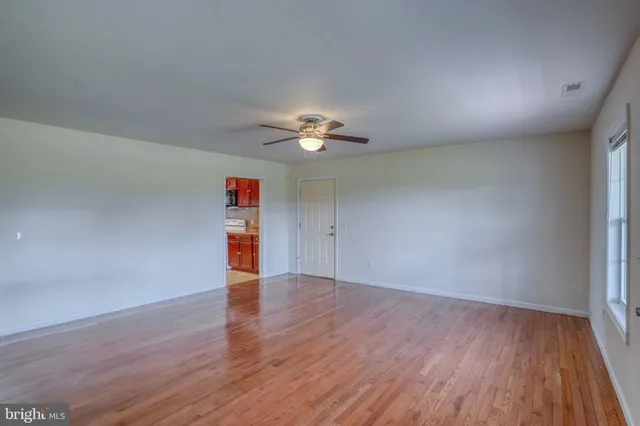 a open kitchen with stainless steel appliances granite countertop a sink and dishwasher a refrigerator with wooden cabinets