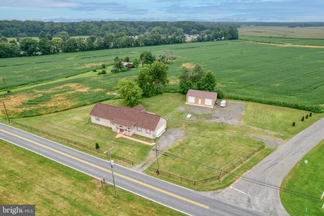 a view of a pool with a yard