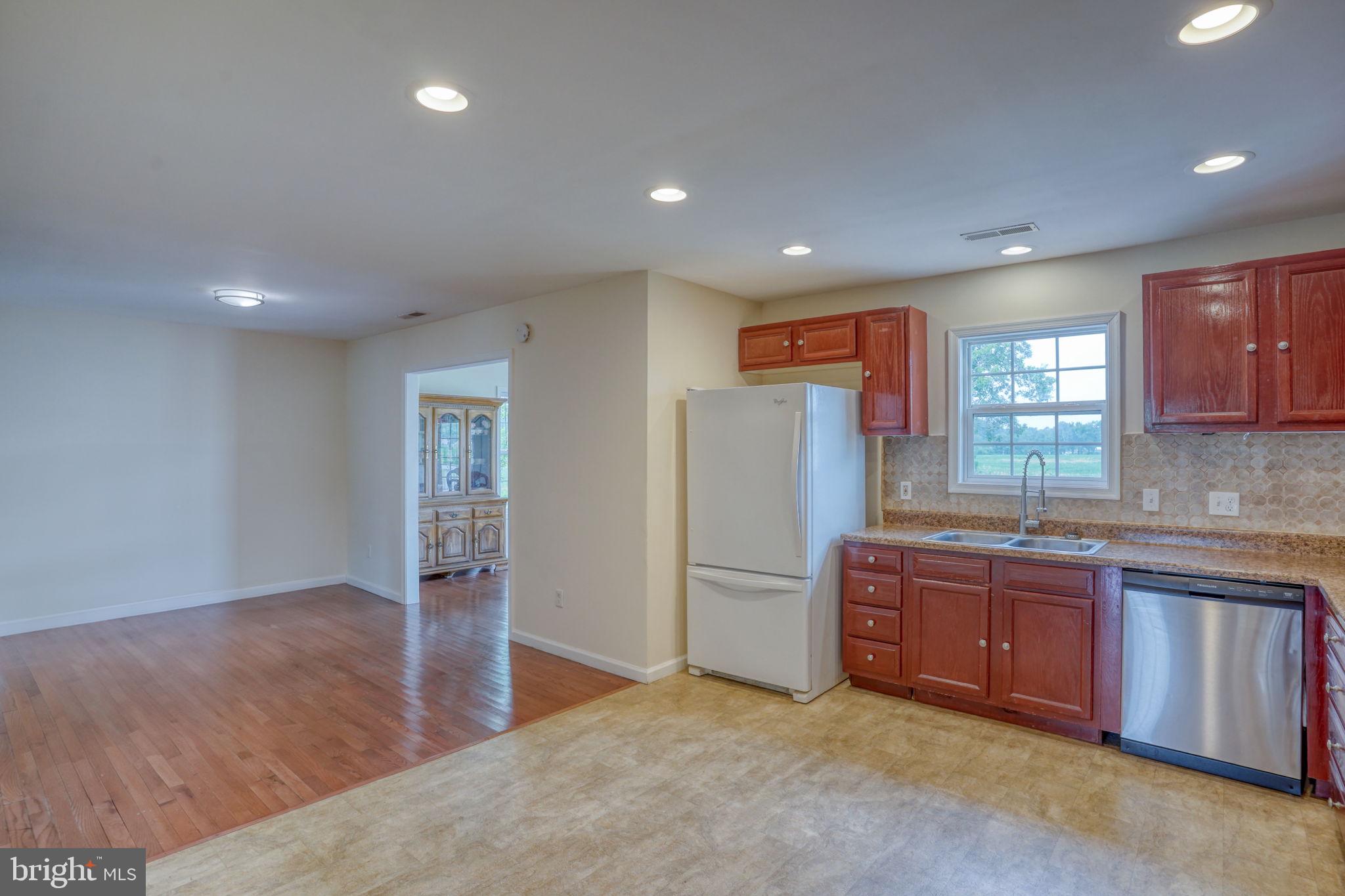 5926 Mt Holly Road East New Market, MD 21631 - Photo 23 of 36 a kitchen with stainless steel appliances granite countertop a refrigerator and a sink
