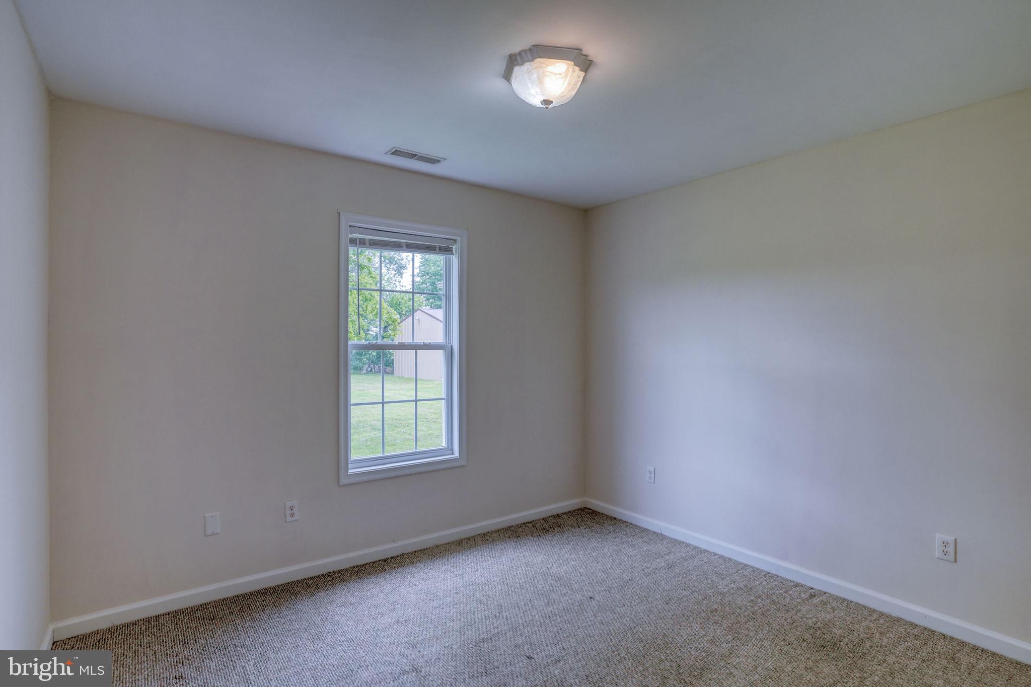 5926 Mt Holly Road East New Market, MD 21631 - Photo 30 of 36 an empty room with windows