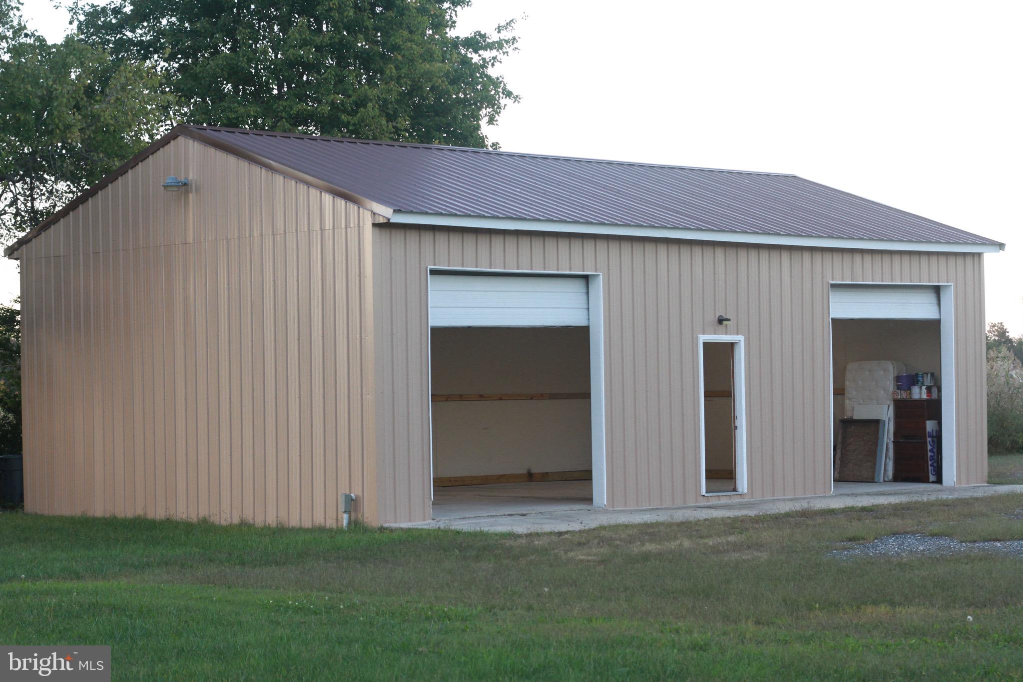 5926 Mt Holly Road East New Market, MD 21631 - Photo 37 of 43 a house with a yard in front of it