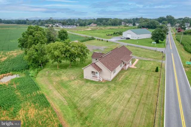 a view of a house with a yard and a large pool