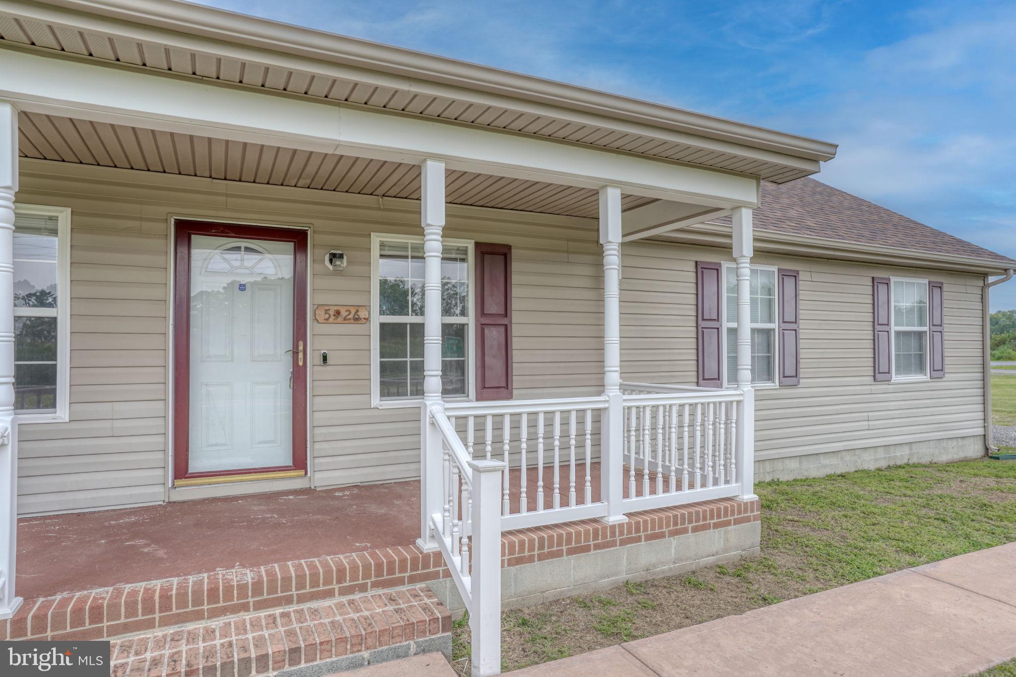 5926 Mt Holly Road East New Market, MD 21631 - Photo 6 of 36 a front view of a house with a garden