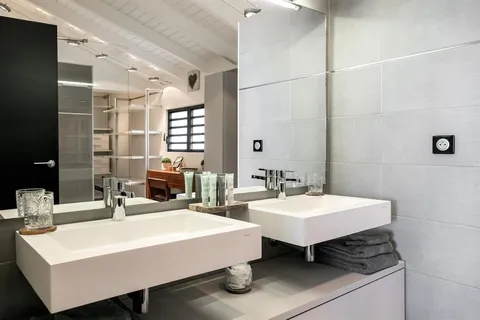 a bathroom with a sink and a mirror