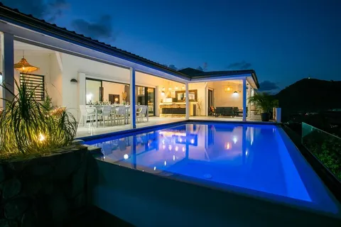 a view of swimming pool with a chair and tables