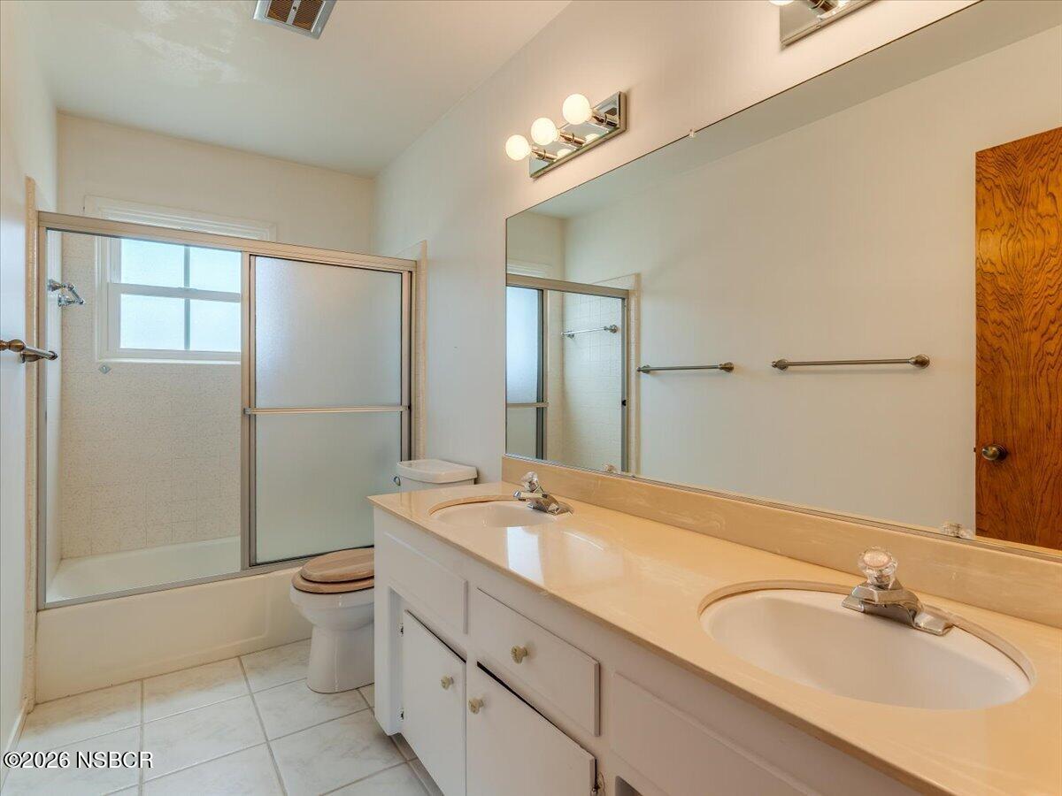 360 Tallyho Road Santa Maria, CA 93455 - Photo 38 of 72 a bathroom with a sink a toilet and shower