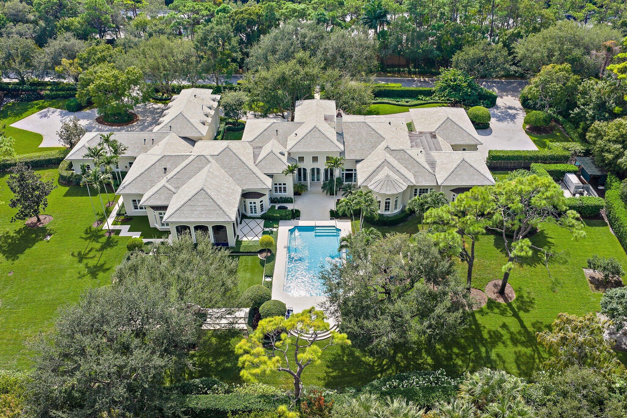 an aerial view of a house with a garden
