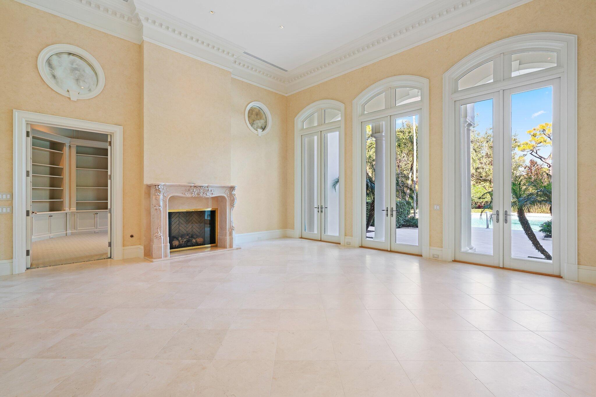 124 Bears Club Drive Jupiter, FL 33477 - Photo 25 of 75 a view of an empty room with glass door and a window
