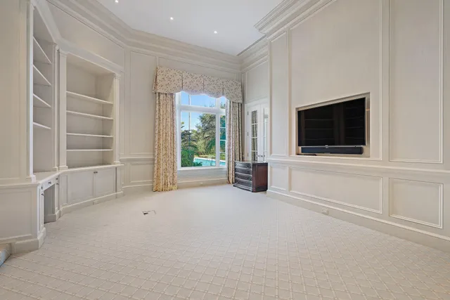 a bath tub sitting in a bathroom next to a window