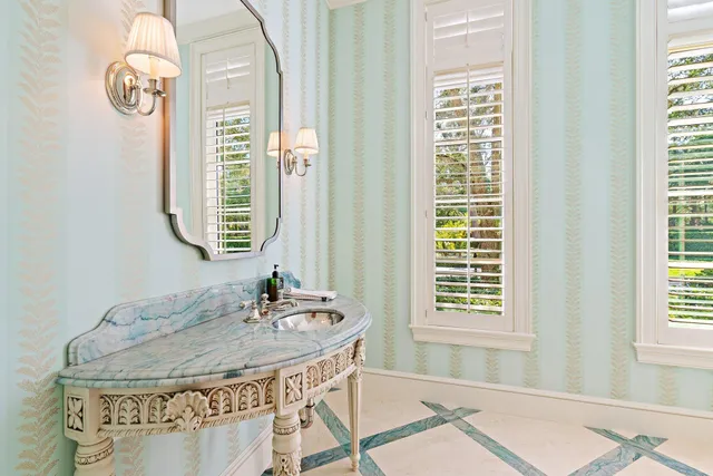 a bathroom with a sink vanity and a mirror