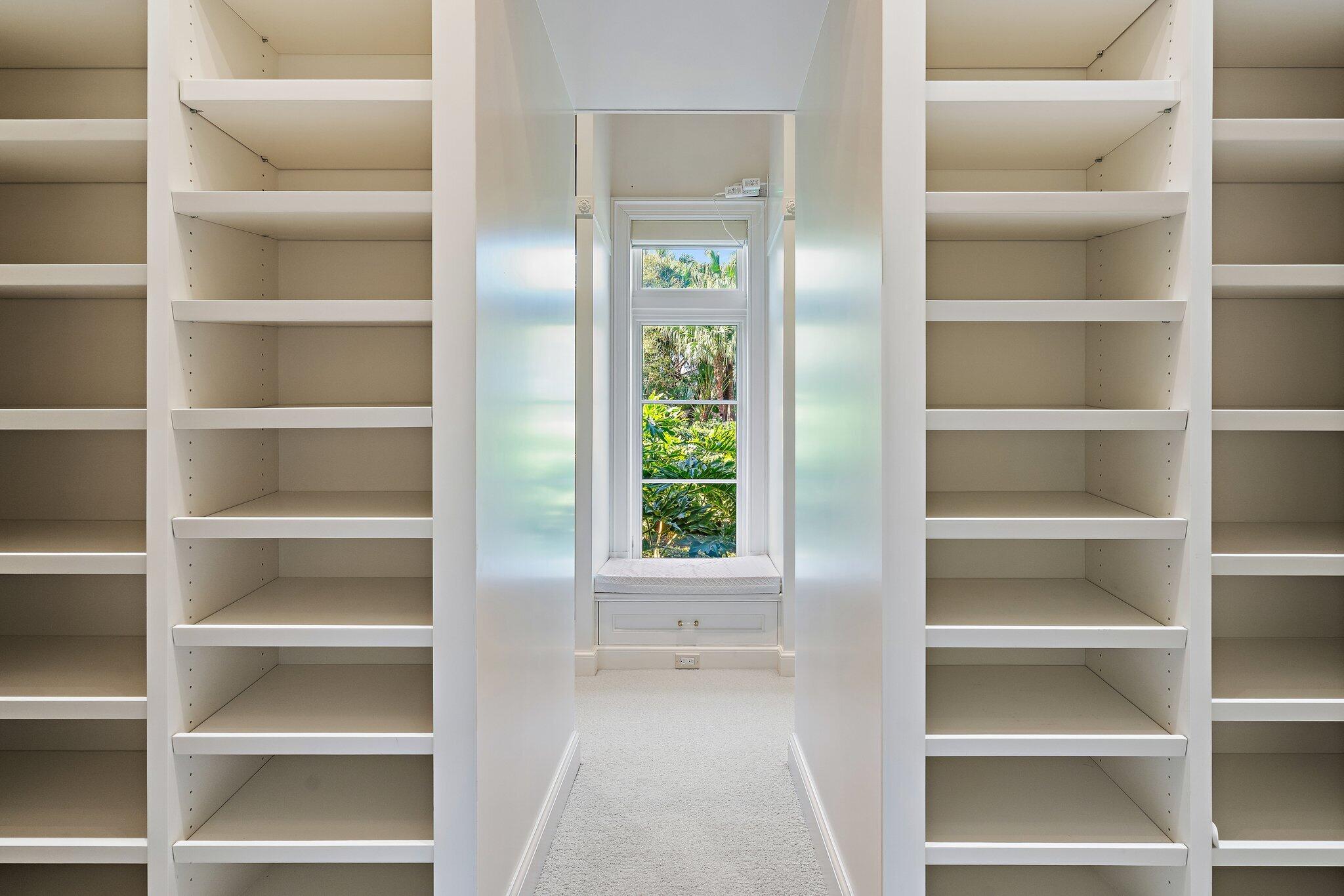 124 Bears Club Drive Jupiter, FL 33477 - Photo 40 of 75 a view of walk in closet with empty racks