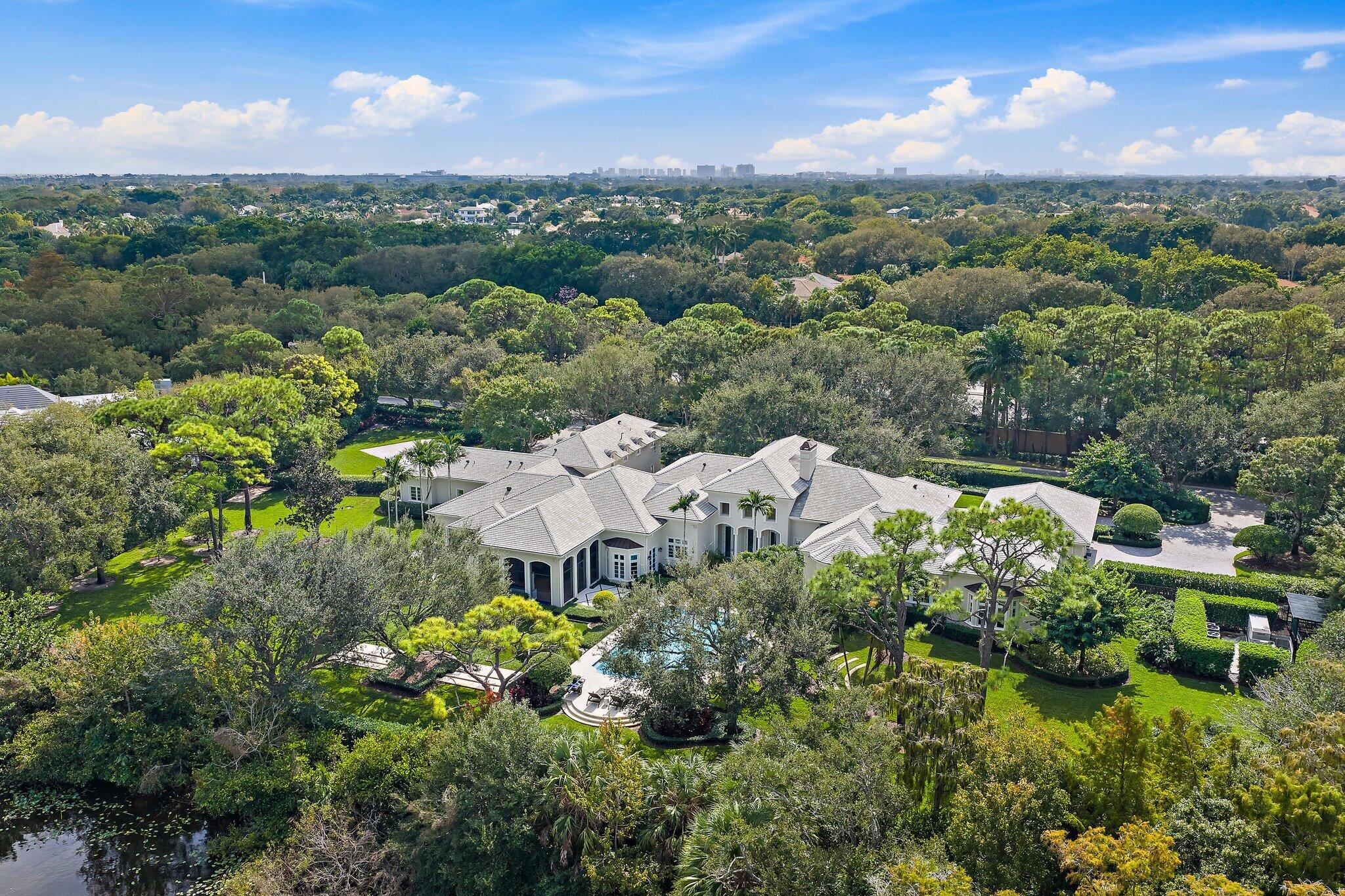 124 Bears Club Drive Jupiter, FL 33477 - Photo 5 of 22 a view of a garden with a houses